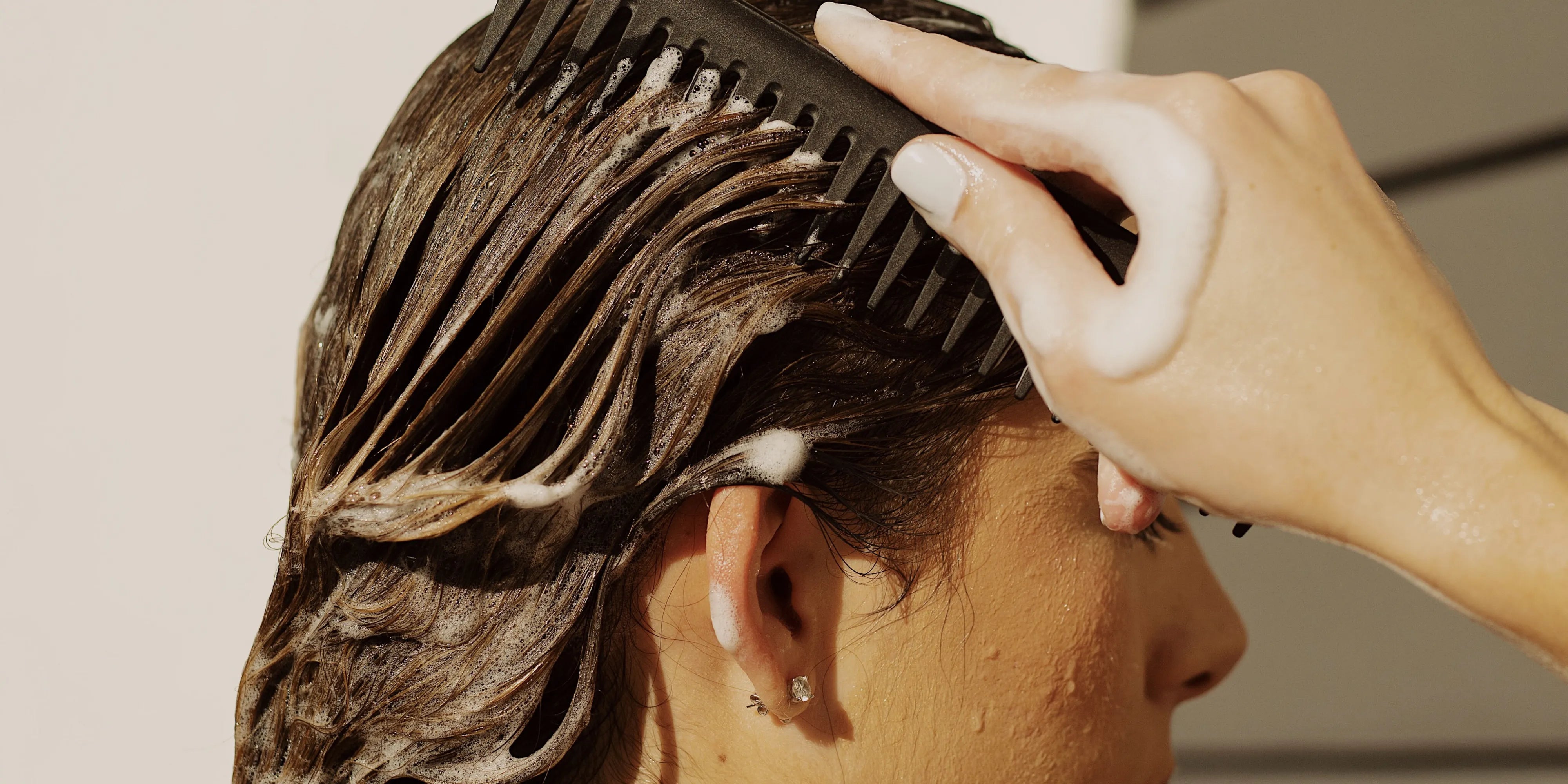 Women washing their hair with Tree Bottle shampoo Bar